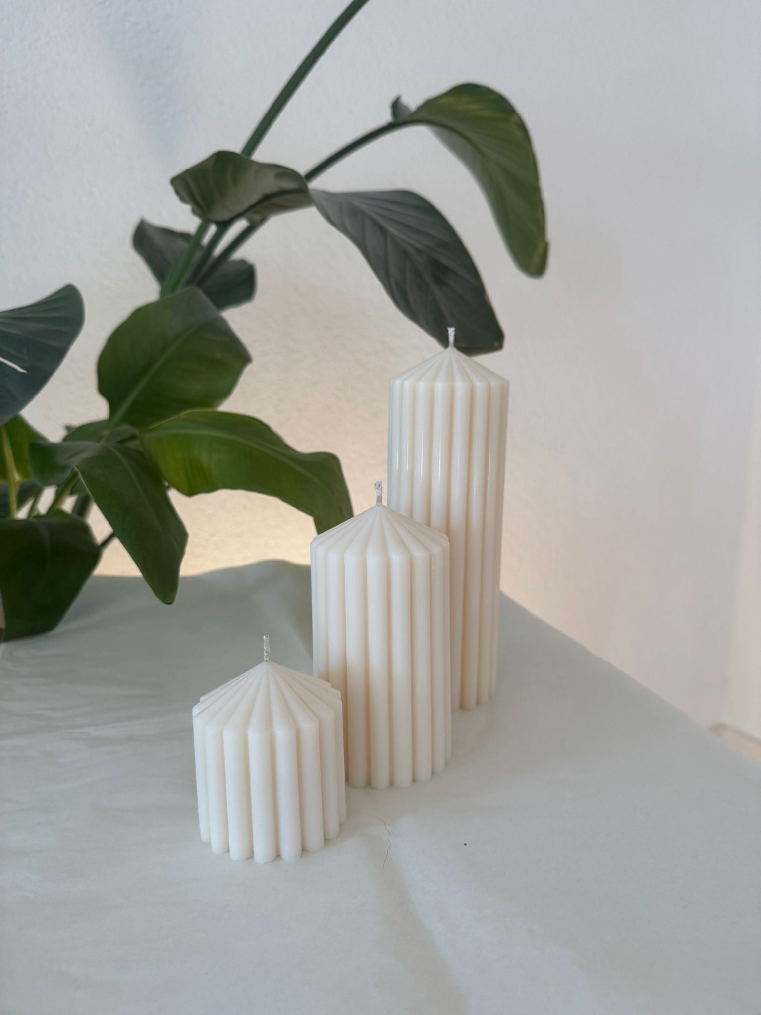 die drei verschiedenen Größen der Stumpenkerze von der Seite abgebildet