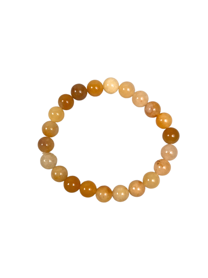 Ein elastisches Armband aus runden, polierten Honig-Calzit-Perlen in warmen Gelb-, Creme- und Bernsteintönen. Das Armband liegt mittig auf einem transparenten bzw. freigestellten Hintergrund, sodass der Fokus ganz auf den harmonischen Farbabstufungen und der glatten, glänzenden Oberfläche der Steine liegt. Ideal als natürlicher Begleiter für Alltag, Meditation oder als symbolisches Geschenk für Kraft und Ausgleich.